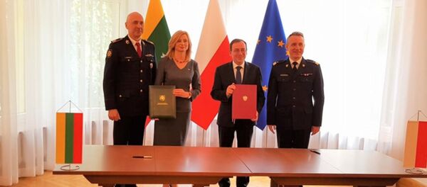 Главы МВД Литвы и Польши Рита Тамашунене и Мариуш Каминьский - Sputnik Lietuva