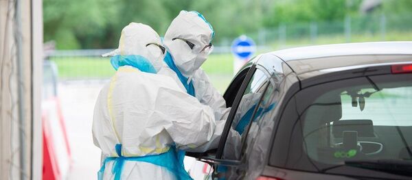 Проверка жителей на коронавирус Проверка жителей на коронавирус - Sputnik Lietuva