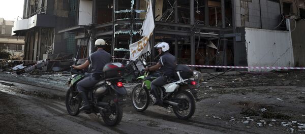 Полиция на месте взрыва в Бейруте Полиция на месте взрыва в Бейруте - Sputnik Lietuva