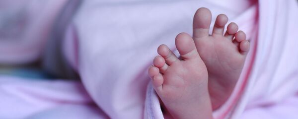 Новорожденный младенец, архивное фото Новорожденный младенец, архивное фото - Sputnik Lietuva