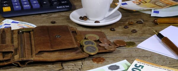 Кошелек с евро монетами - Sputnik Литва