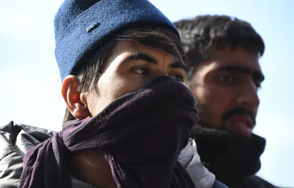 Žmonės nelegalių migrantų iš Afganistano stovykloje, Baltarusijos ir Lenkijos pasienyje. - Sputnik Lietuva