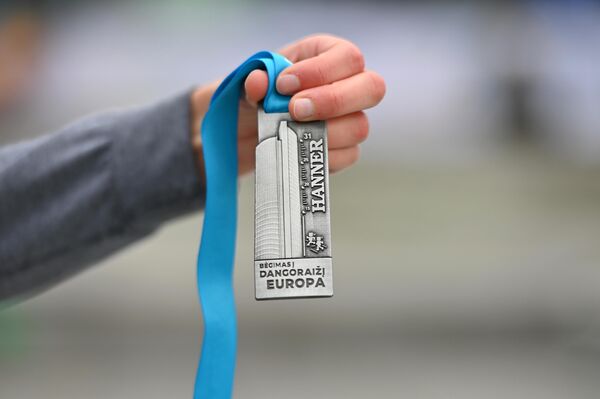 Nuotraukoje: varžybų dalyvio atminimo medalis. - Sputnik Lietuva
