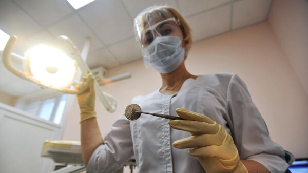 Врач-стоматолог, архивное фото - Sputnik Литва