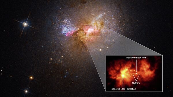 Nykštukinės galaktikos Henize 2-10 centrinė sritis su juodąja skyle ir žvaigždės sprogimu - Sputnik Lietuva