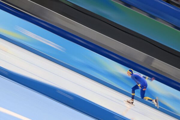 Švedas Nilsas Van Der Poelis 2022 metų vasario 6 dieną Pekino nacionaliniame greitojo čiuožimo ovale dalyvauja vyrų greitojo čiuožimo 5 000 m rungtyje. - Sputnik Lietuva