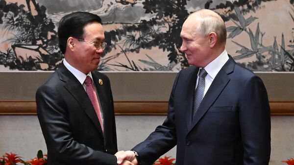 Президент РФ Владимир Путин и президент Вьетнама Во Ван Тхыонг во время встречи в Пекине - Sputnik Литва