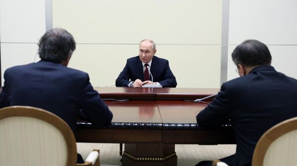 Президент России Владимир Путин во время встречи с генеральным директором Международного агентства по атомной энергии Рафаэлем Гросси - Sputnik Литва