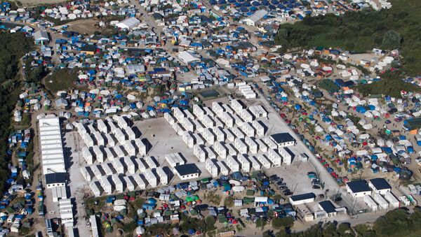 Несанкционированный лагерь мигрантов в Кале, Франция - Sputnik Lietuva