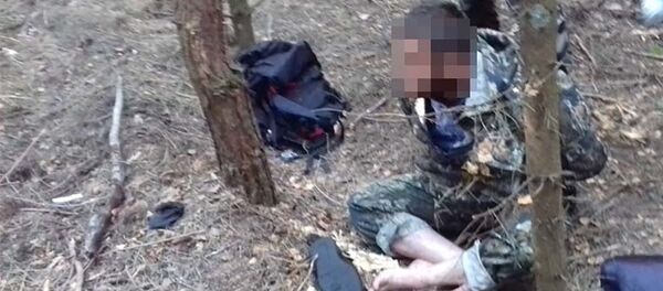 Задержанные мигранты из Вьетнама Задержанные мигранты из Вьетнама - Sputnik Литва