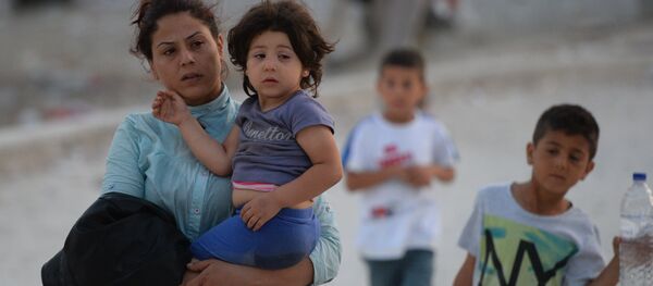 Беженка с детьми. Архивное фото - Sputnik Литва