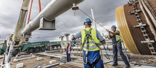 Установка камеры приёма ДОУ на строительной площадке в Любмине, архивное фото - Sputnik Литва