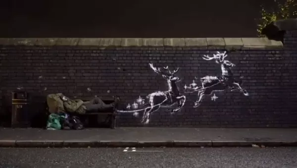 Benamis Kalėdų senelis: menininkas Banksy pristatė naują grafitį