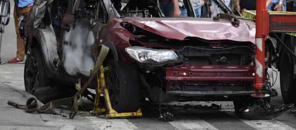 Взорванный автомобиль на перекрестке улиц Богдана Хмельницкого и Ивана Франко, в котором погиб журналист Павел Шеремет, архивное фото - Sputnik Литва