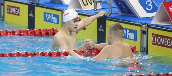 Пловцы Сунь Ян и Данас Рапшис, 18 января 2020 года - Sputnik Литва