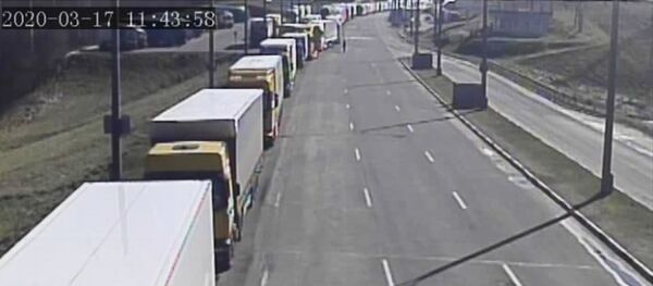 Eilė patikros punkte Kamennyj Log, 2020 m. kovo 17 d. Eilė patikros punkte Kamennyj Log, 2020 m. kovo 17 d. - Sputnik Lietuva