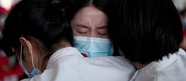 Медицинские работники в международном аэропорту Ухань-Тяньхэ, Китай Медицинские работники в международном аэропорту Ухань-Тяньхэ, Китай - Sputnik Lietuva