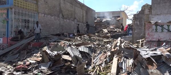 Жизнь на руинах: гаитяне после урагана Мэтью разбирают завалы домов - Sputnik Lietuva