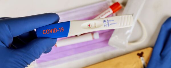 Прибор для экспресс-тестирования на массовое распространение вируса COVID-19 - Sputnik Литва