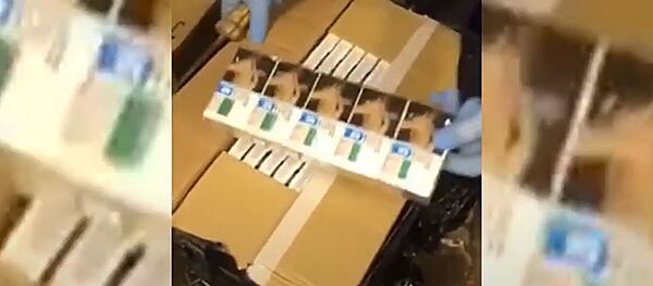 Полиция Литвы показала на видео обыски по делу о контрабанде сигарет и алкоголя - Sputnik Литва