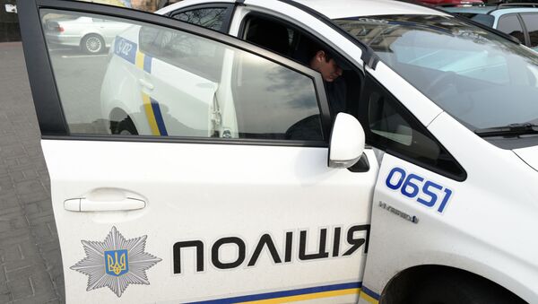Сотрудник украинской полиции в Киеве - Sputnik Литва