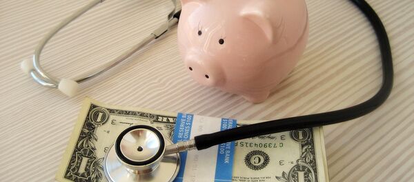 Свинка-копилка и доллары - Sputnik Литва