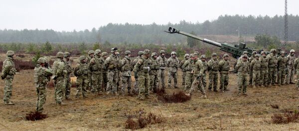 Военные учения НАТО на полигоне Адажи в Латвии. Архивное фото - Sputnik Литва