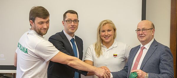 Рута Мейлутите и мэр Каунаса Висвалдас Матийошайтис, тренер Руты Эмилиюс Вайтайтис - Sputnik Литва