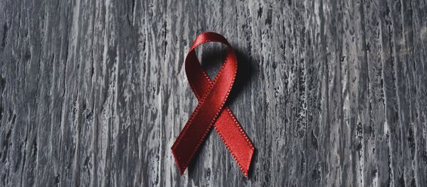 Красная ленточка - знак борьбы со СПИДом - Sputnik Литва