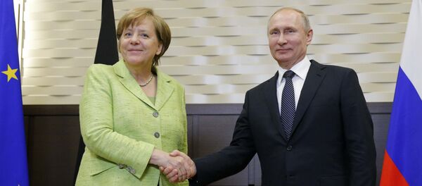 Владимир Путин и Ангела Меркель - Sputnik Литва