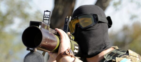 Человек с гранатометом - Sputnik Литва