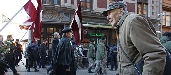 Участники шествия в честь Дня легионеров СС в Риге 16 марта 2017 года Участники шествия в честь Дня легионеров СС в Риге 16 марта 2017 года - Sputnik Литва