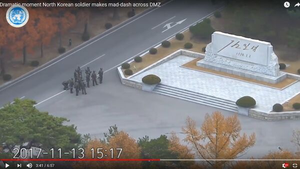 Опубликованы кадры побега солдата из КНДР в Южную Корею - Sputnik Литва