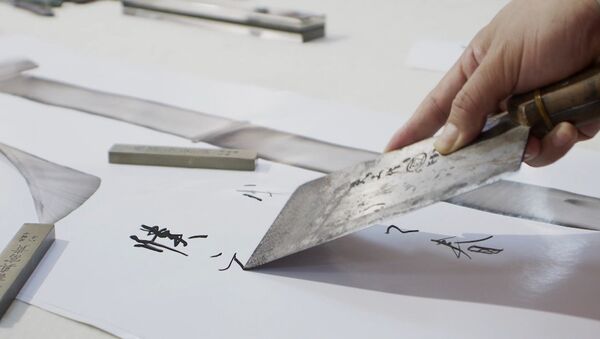 Китайский каллиграф рисует иероглифы поварскими ножами - Sputnik Литва