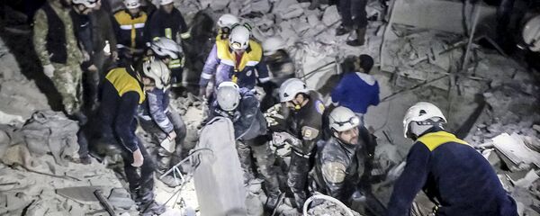 Белые каски в Сирии разбирают завалы, архивное фото - Sputnik Литва