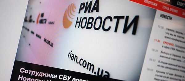 Сайт rian.com.ua на экране монитора - Sputnik Литва