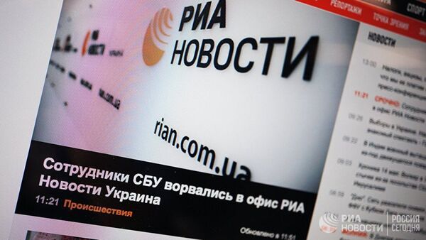 Сайт rian.com.ua на экране монитора - Sputnik Литва