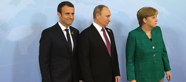 Президент России Владимир Путин, президент Франции Эммануэль Макрон и канцлер Германии Ангела Меркель Президент России Владимир Путин, президент Франции Эммануэль Макрон и канцлер Германии Ангела Меркель - Sputnik Литва