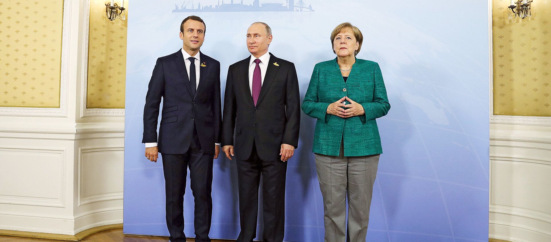 Rusijos prezidentas Vladimiras Putinas, Vokietijos kanclerė Angela Merkel ir Prancūzijos prezidentas Emanuelis Makronas - Sputnik Lietuva, 1920, 31.03.2021
