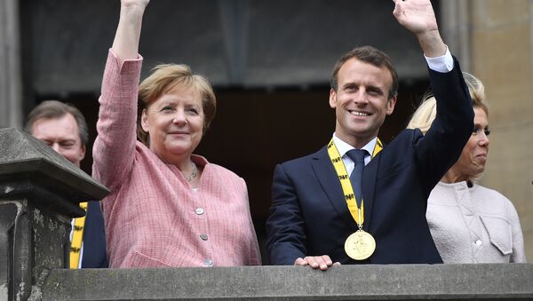 Vokietijos kanclerė Angela Merkel ir Prancūzijos prezidentas Emanuelis Makronas - Sputnik Lietuva