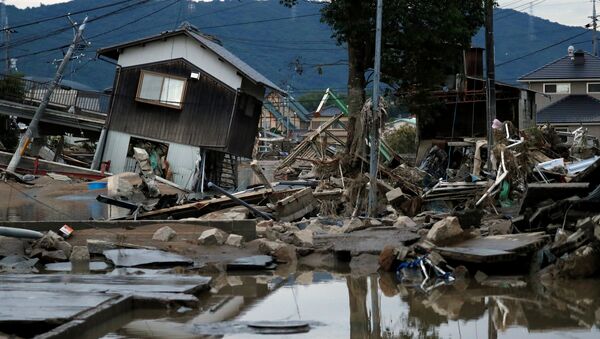 Разрушенные дома в затопленном районе в Курасики, Япония, 8 июля 2018 года - Sputnik Lietuva