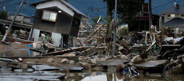 Разрушенные дома в затопленном районе в Курасики, Япония, 8 июля 2018 года Разрушенные дома в затопленном районе в Курасики, Япония, 8 июля 2018 года - Sputnik Lietuva