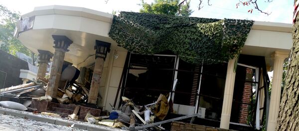 Ситуация на месте взрыва в донецком кафе Сепар - Sputnik Литва