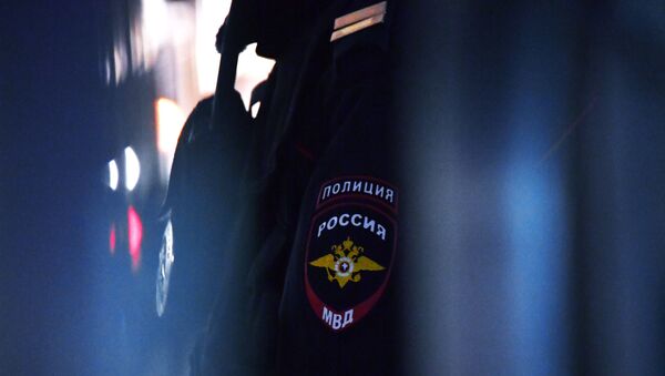Эмблема на форме сотрудника полиции. - Sputnik Литва