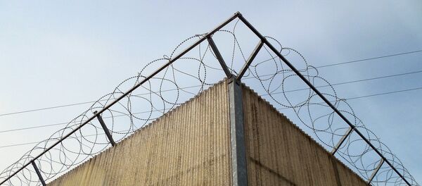 Стена мест временного заключения - Sputnik Литва