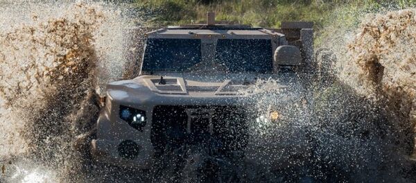 Бронированный внедорожник JLTV, архивное фото Бронированный внедорожник JLTV, архивное фото - Sputnik Литва