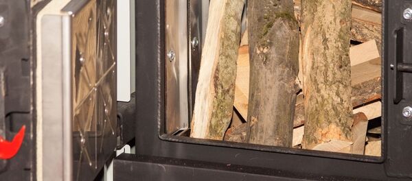 Котел на твердом топливе для дома, архивное фото - Sputnik Литва