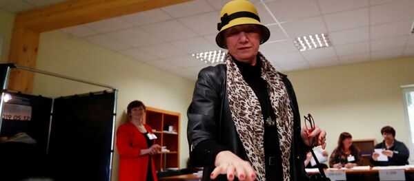 Избиратели голосуют на выборах президента Литвы, 12 мая 2019 года Избиратели голосуют на выборах президента Литвы, 12 мая 2019 года - Sputnik Lietuva