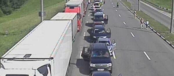 Очереди на границе с Литвой в контрольно-пропускном пункте Каменный Лог, 13 июля 2019 Очереди на границе с Литвой в контрольно-пропускном пункте Каменный Лог, 13 июля 2019 - Sputnik Lietuva