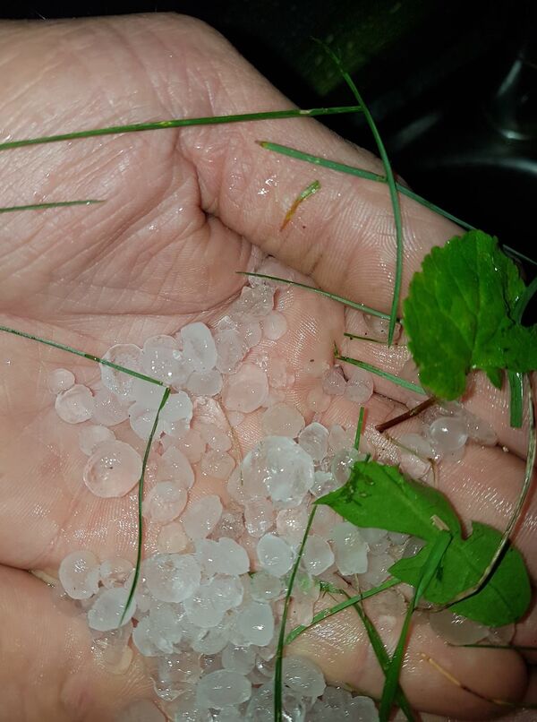 Šiluma traukiasi: sinoptikai žada perkūniją ir krušą Šiluma traukiasi: sinoptikai žada perkūniją ir krušą - Sputnik Lietuva